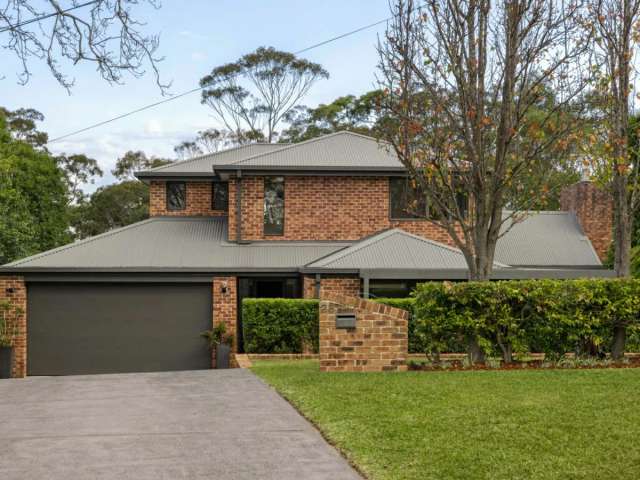 Architectural family home with bushland backdrop