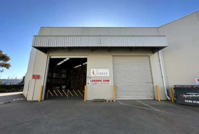 TWO ROLLER DOORS WITH STREET FRONTAGE