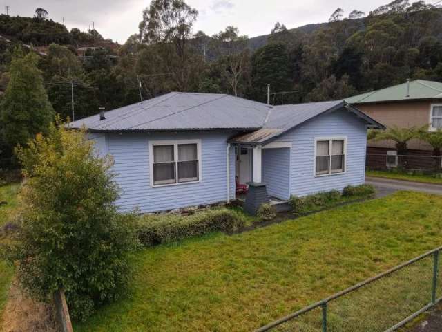 Quaint Three-Bedroom House with Character Features and Rental Appeal!