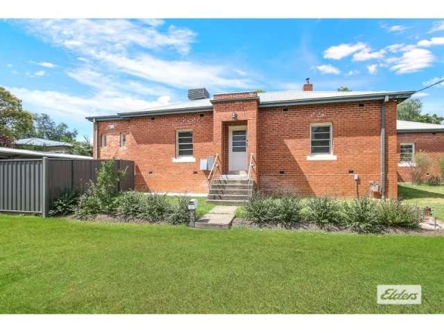 Your Heritage Red Brick Townhouse Awaits